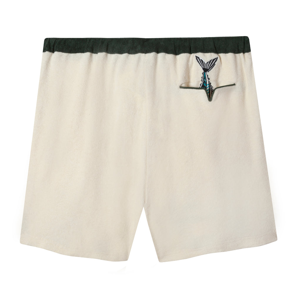 Flat lay back view of angler shorts showing the embroidered fish tail sticking out the back pocket, also piped with forest green