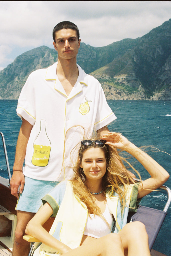 man and woman smile at camera