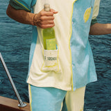 Male model putting bottle of wine into the limoncello pocket