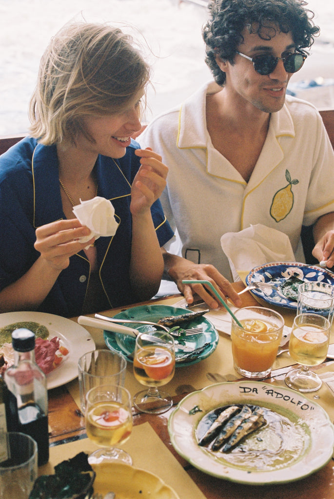 man and woman eat lunch at Da Adolfo