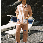 Made from 100% organic cotton terry cloth, this three-piece set boasts waves, fish, and 'SCUBA' embroidery, and comes with matching pants and a bucket hat