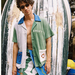 male model in water sport cabana and water sport towel wrapped around waist