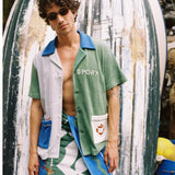 male model in water sport cabana and water sport towel wrapped around waist