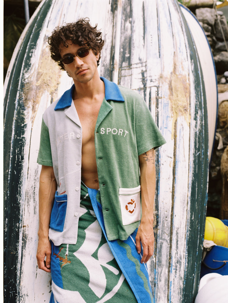 male model in water sport cabana and water sport towel wrapped around waist