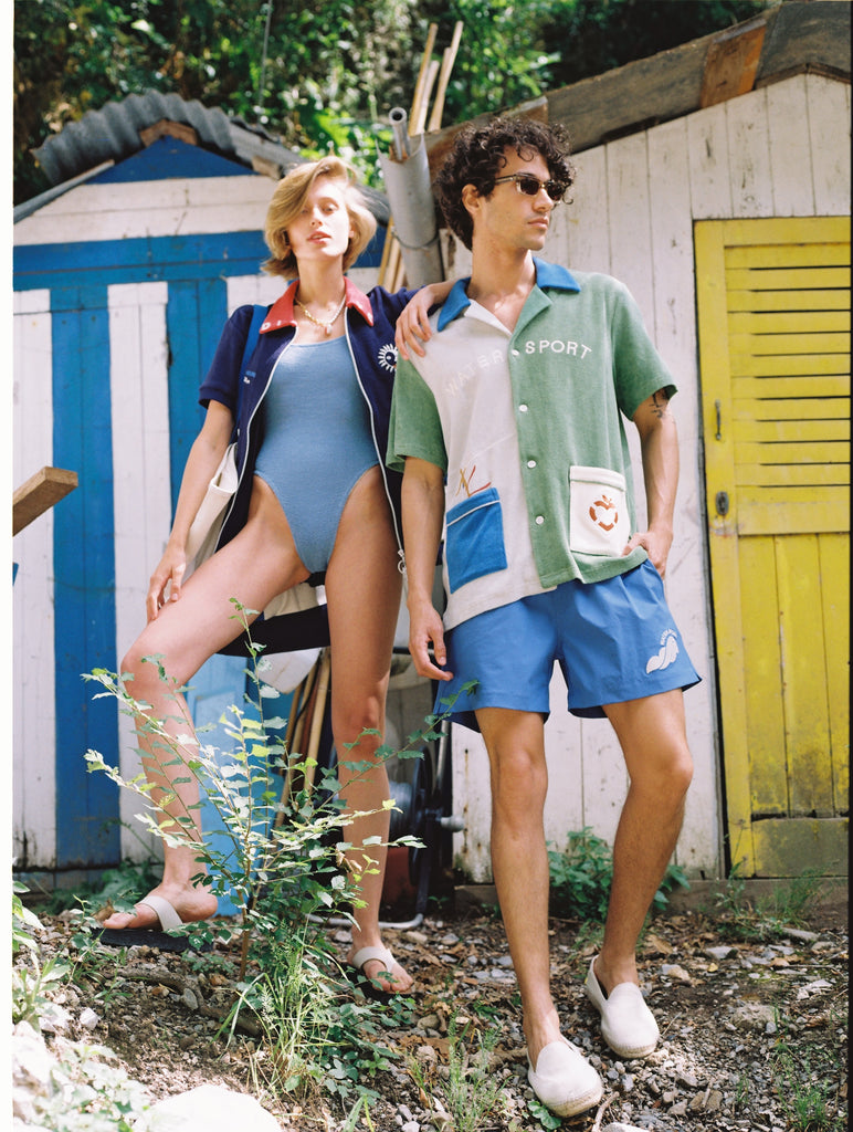 Female model with arm resting on male model wearing the full water sport sets shoulder