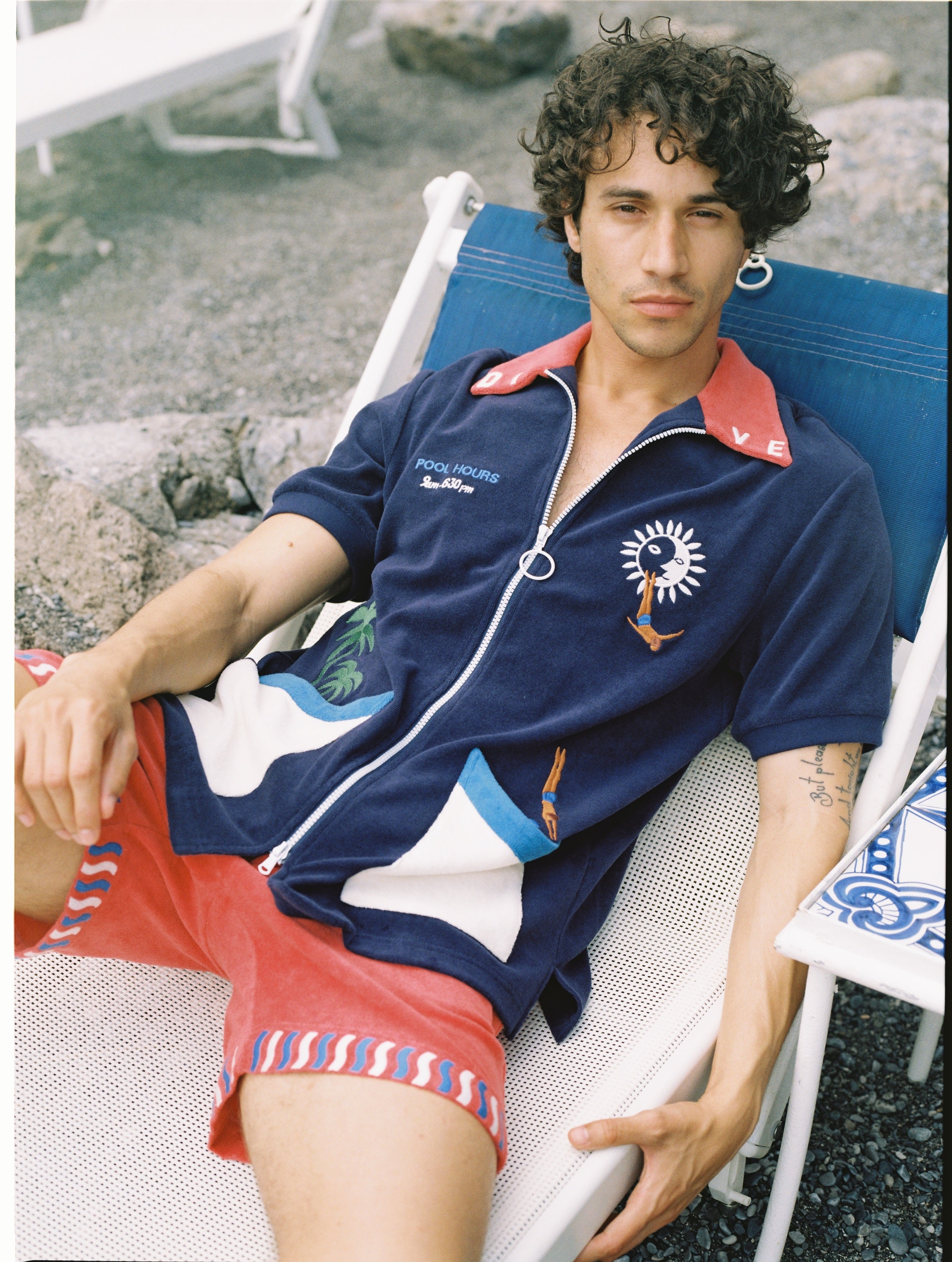 Male model in beach chair in dive cabana