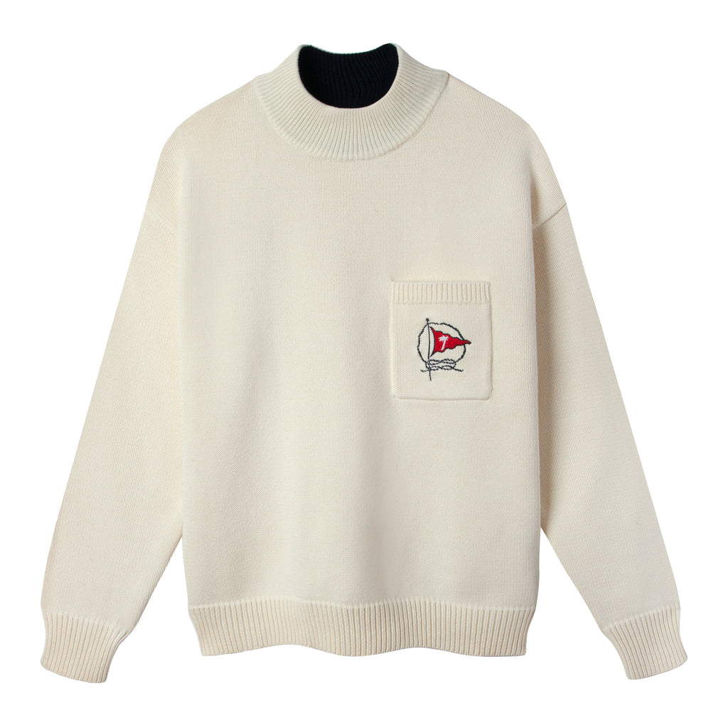 Product photo of beige Tombolo Mariner sweater with red flag embroidered on chest pocket against white backdrop