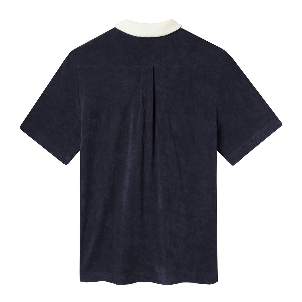 Back of navy Tombolo polo showing back pleating
