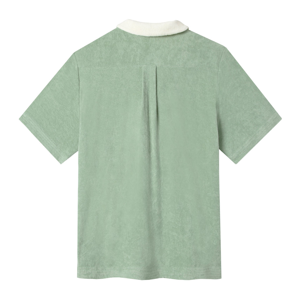 Back shot of terry cloth polo showing back pleat