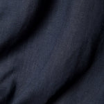 Close up image of the navy linen used to make the shirt