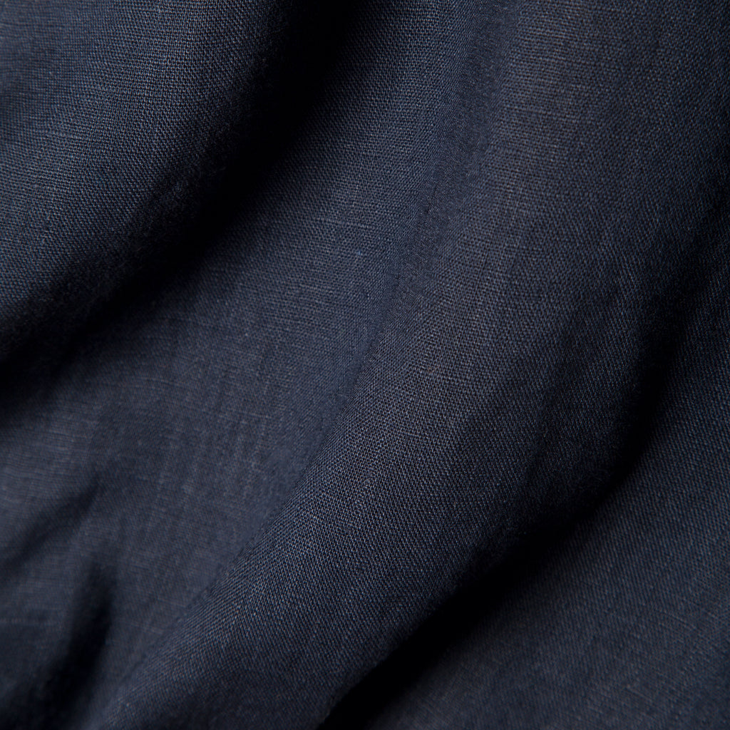 Close up image of the navy linen used to make the shirt