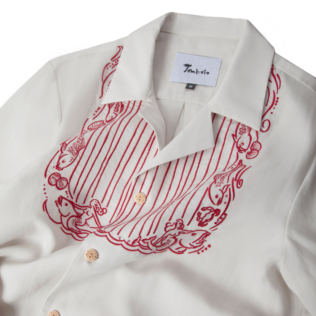 Close up of the red embroidered bib