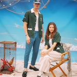 Male and female models posing in shirt, one standing and the other sitting