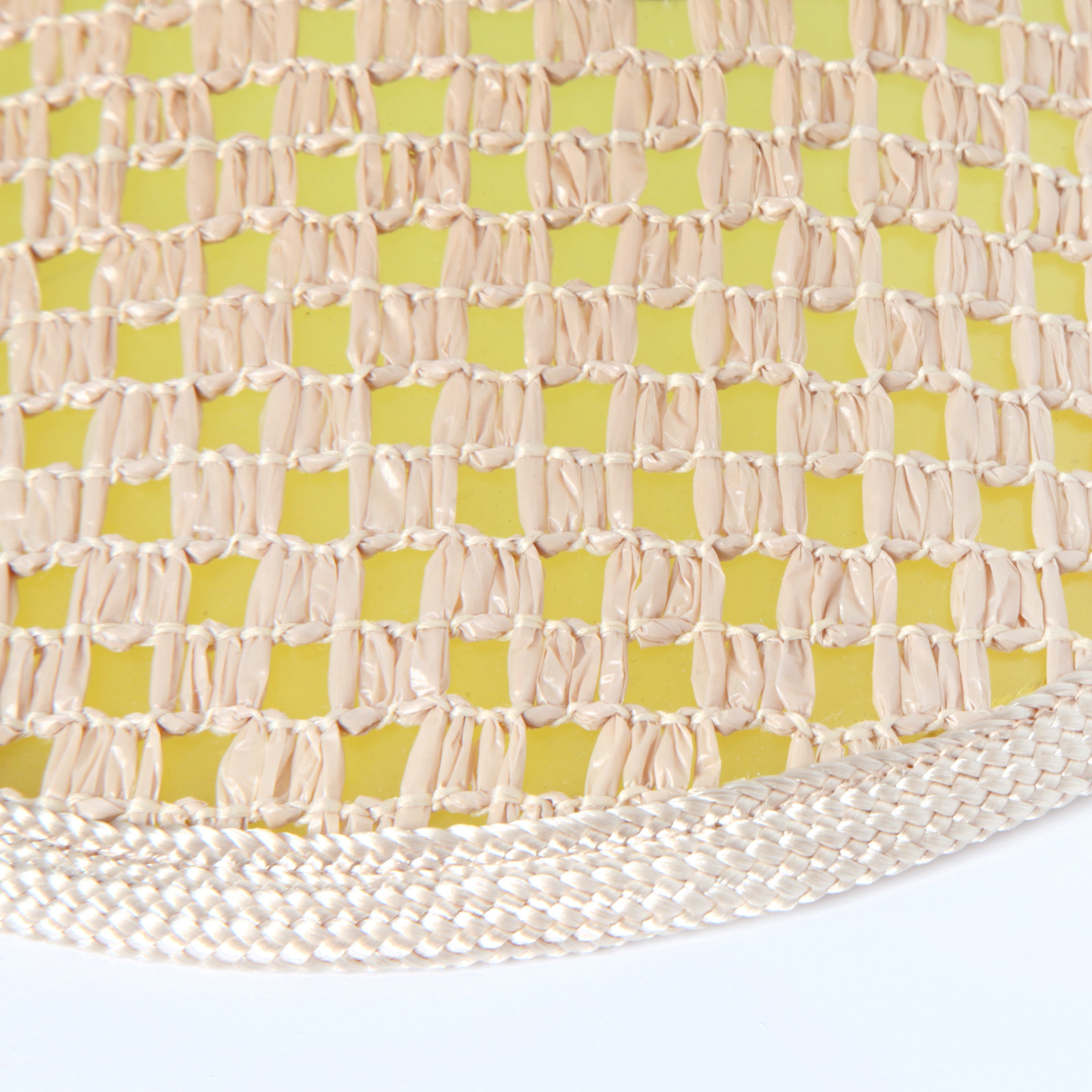 Close up of weave over top the yellow plastic brim