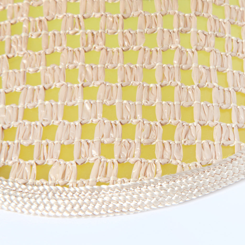 Close up of weave over top the yellow plastic brim
