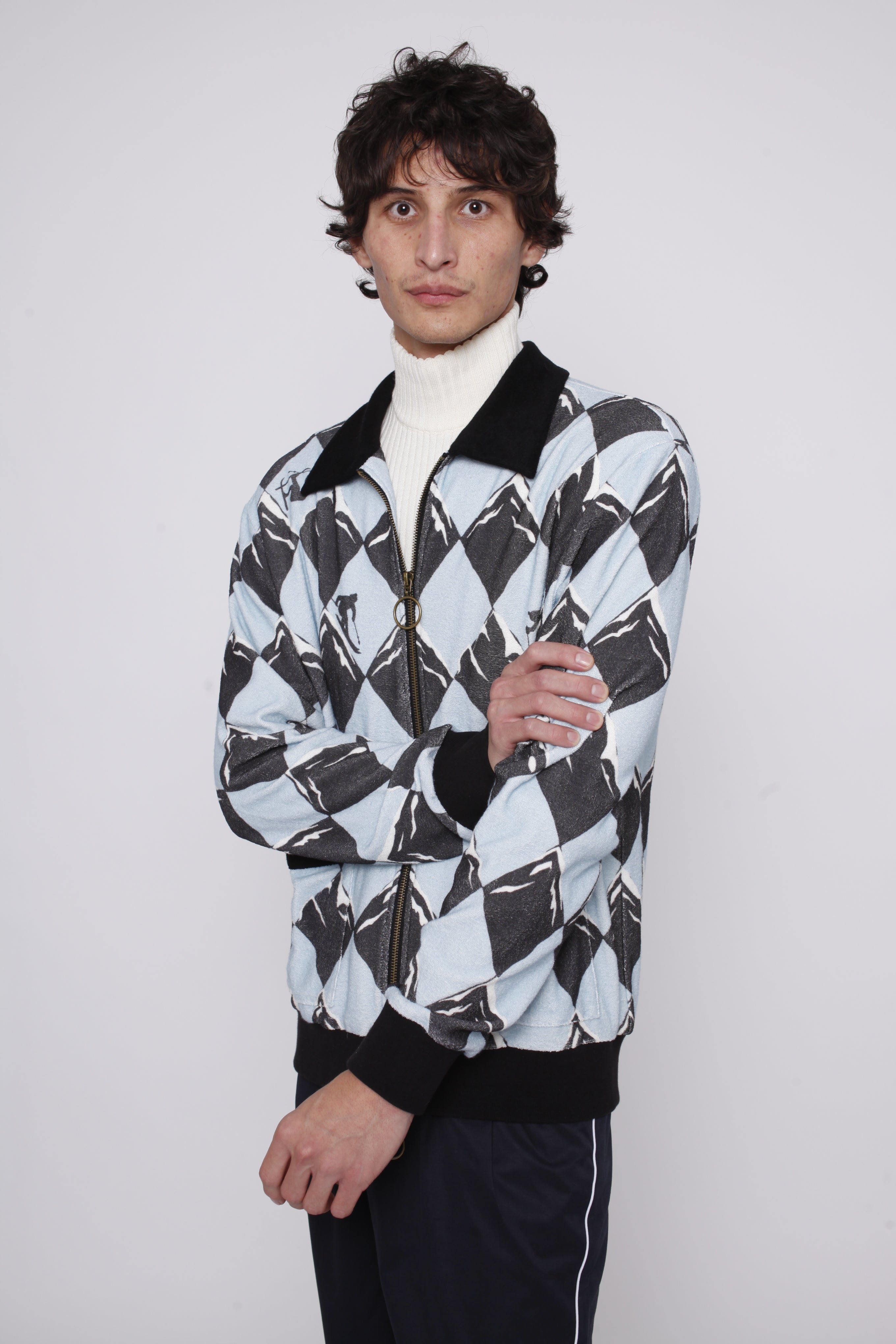 Male model posing in cabana and traveler pants