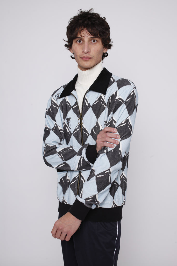 Male model posing in cabana and traveler pants