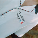 sideways close up of le french diner on shirt