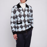 male model in cabana, traveler pants, white turtleneck