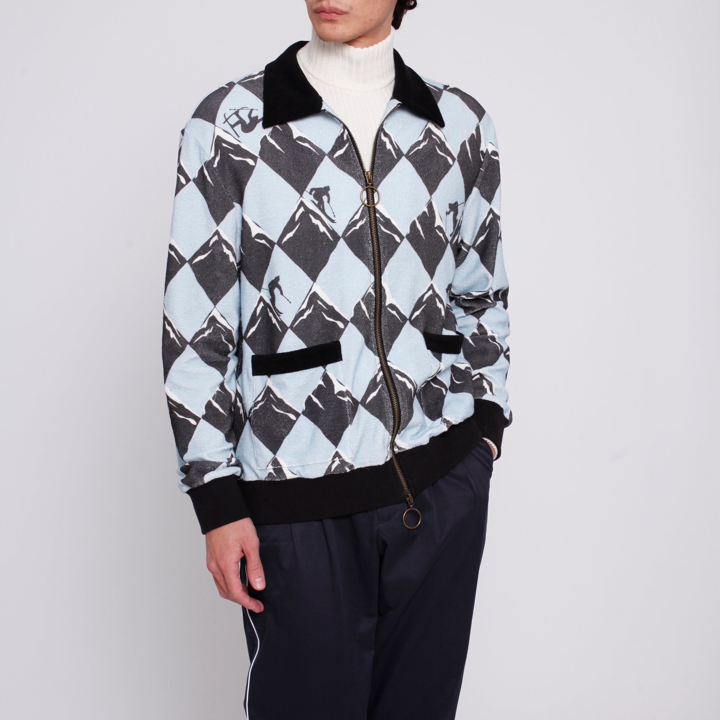 male model in cabana, traveler pants, white turtleneck