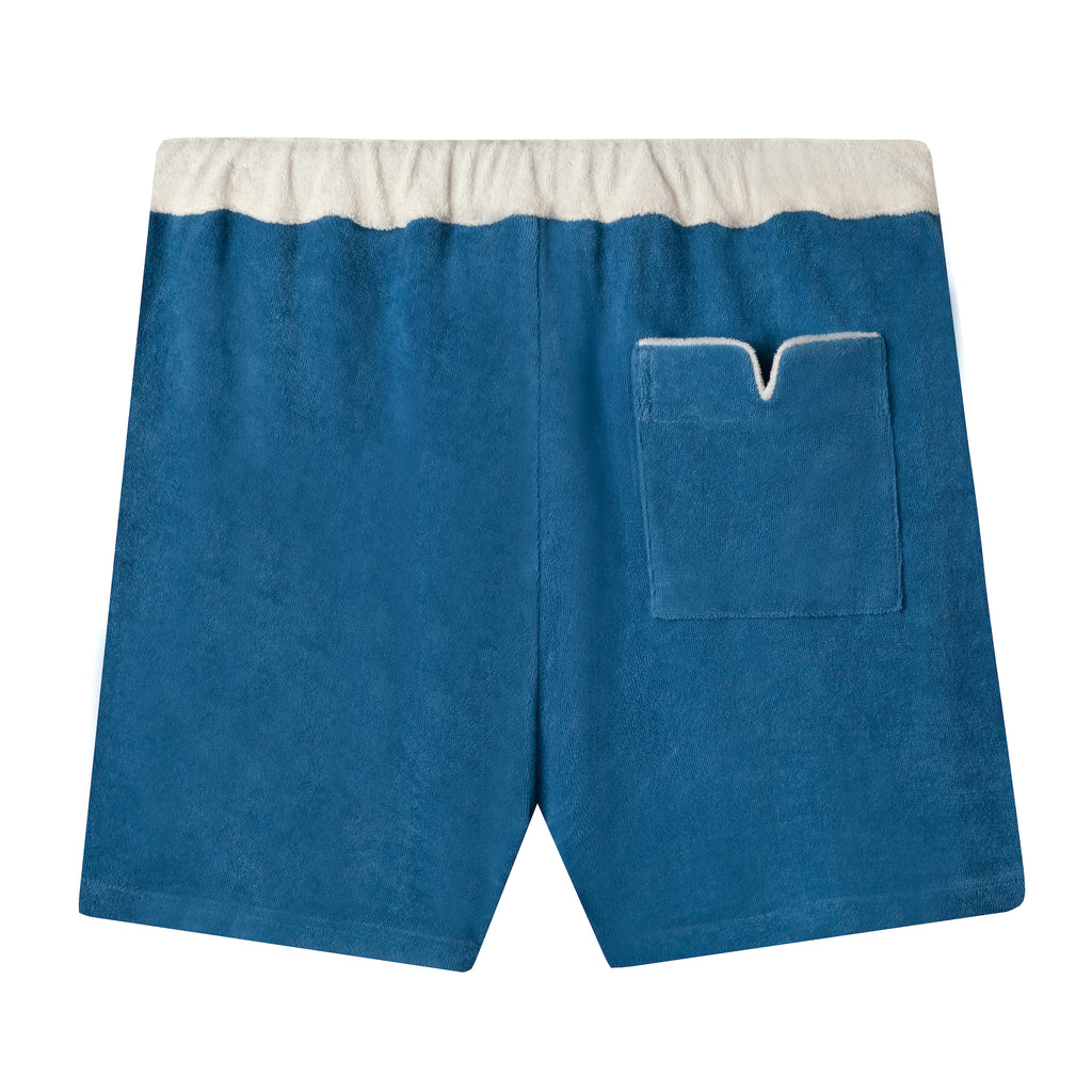 back view of shorts with white waistband and white piped pocket with signature v