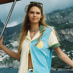 Female model wearing limoncello set on a boat