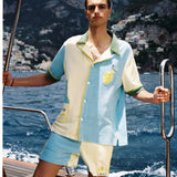 Male model wearing limoncello set on a boat off the coast of positano