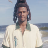 Male model wearing the shirt on the beach