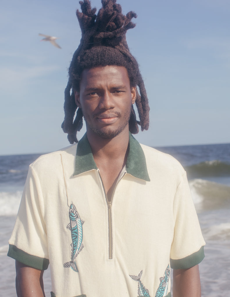 Male model wearing the shirt on the beach
