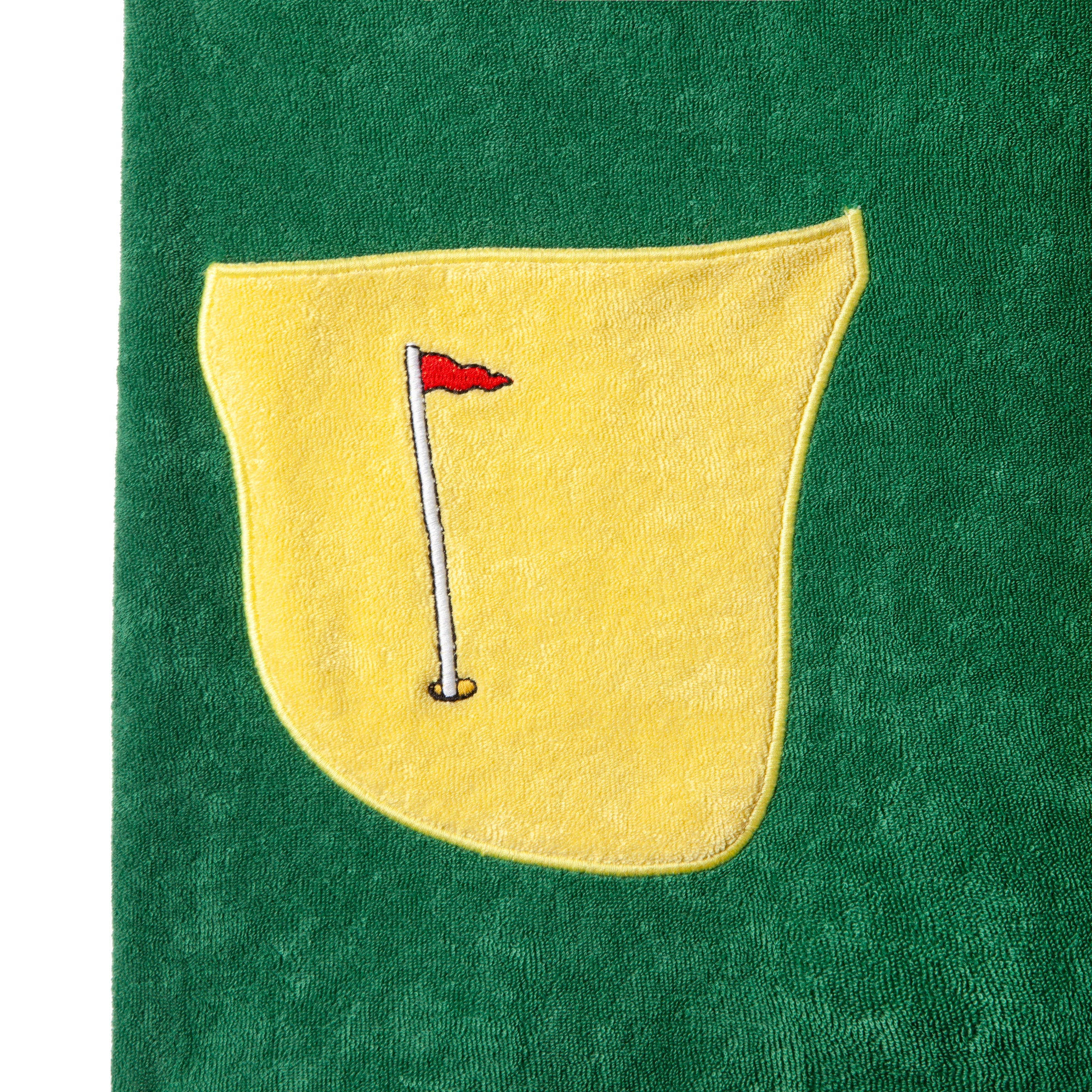 Close up of the patch pocket representing a bunker with flag embroidery