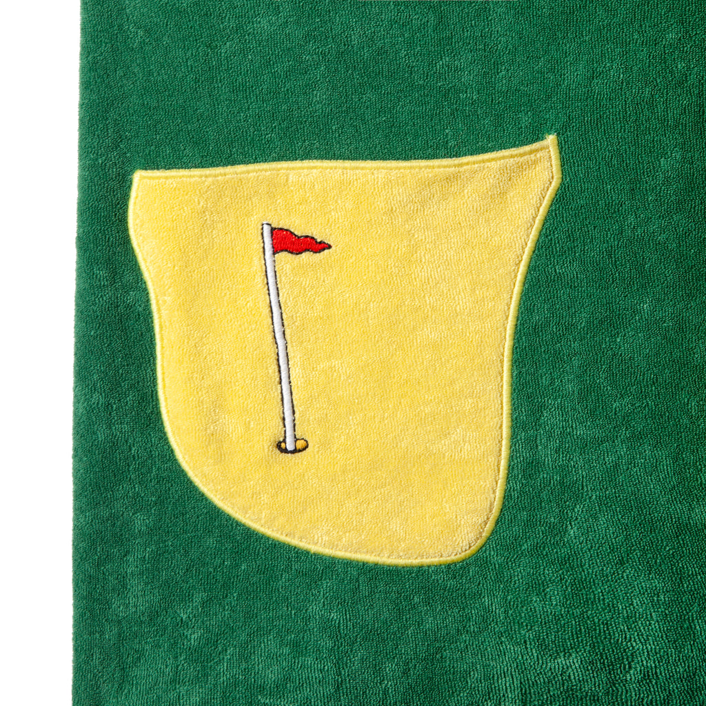 Close up of the patch pocket representing a bunker with flag embroidery