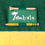 close up of Tombolo patch on sleeve with custom golf tee and pencil holder loops