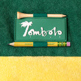 close up of Tombolo patch on sleeve with custom golf tee and pencil holder loops
