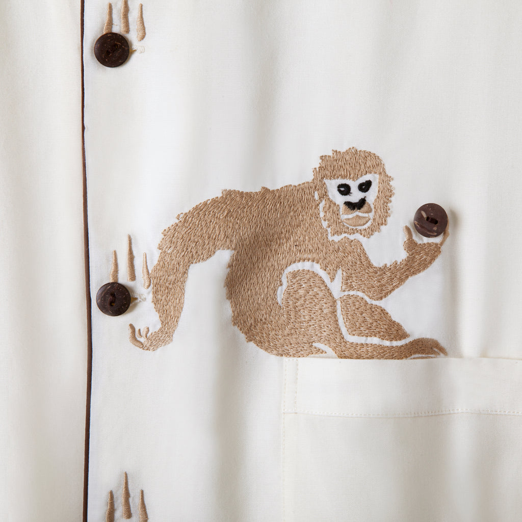 Close up of the monkey holding the coconut button