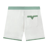 back view product photo of shorts, showing white and green striped waistband and v pocket with green strip at top