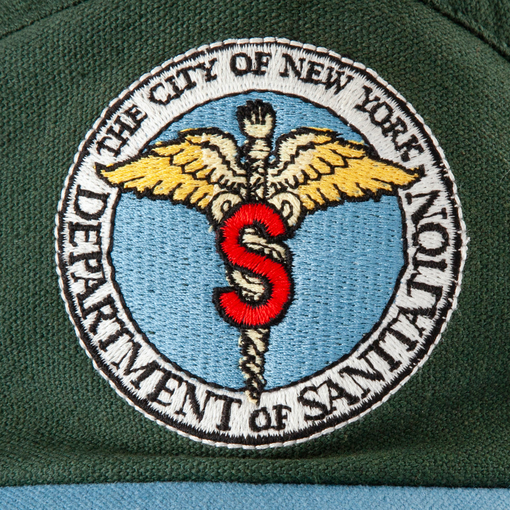 Close up of the embroidered DSNY caduceus logo