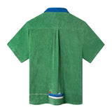 back view of the shirt, all green with a box drape panel and a little row boat at the bottom middle