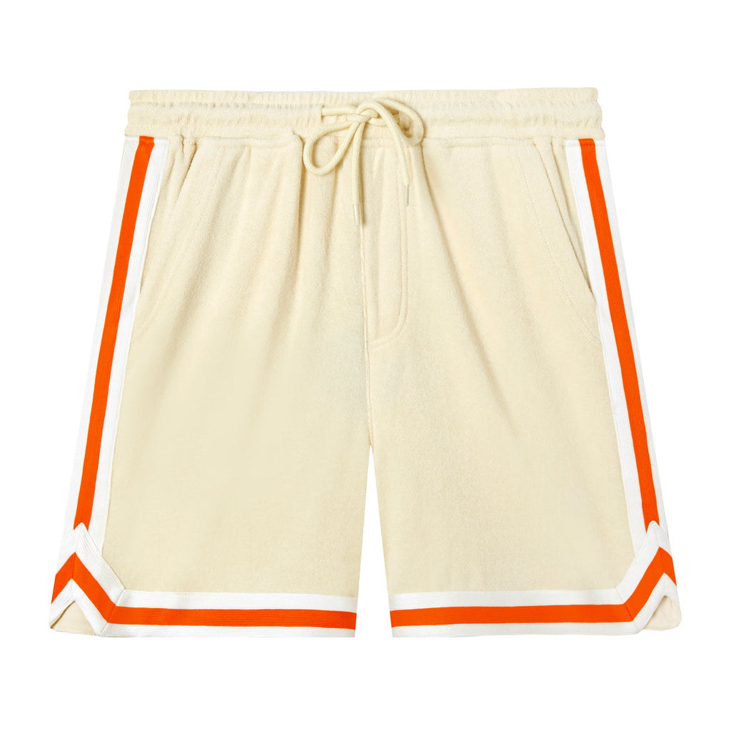 Beige shorts with white and orange varsity tape bordering the leg openings and sides of legs.