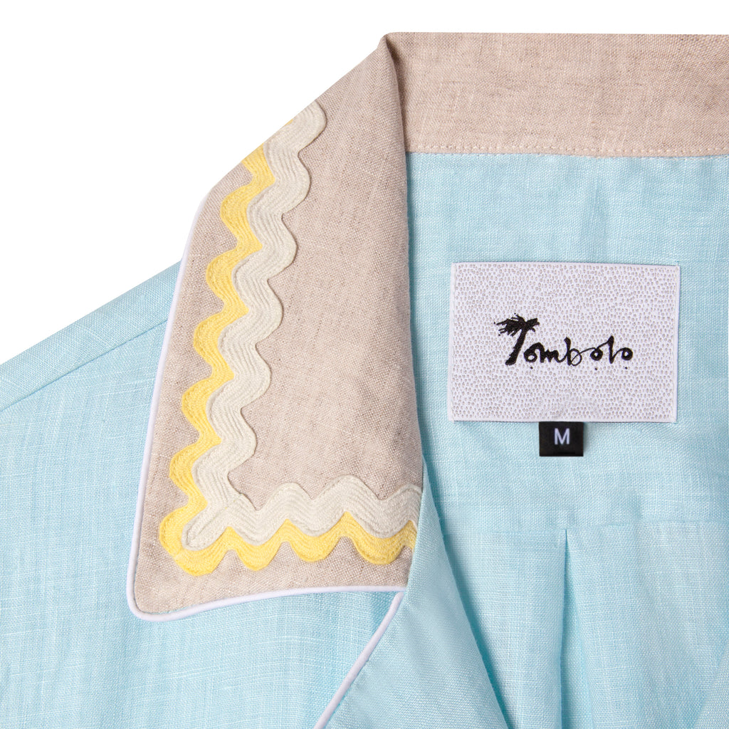 Yellow ruffle trim lining collar, showing out when folded