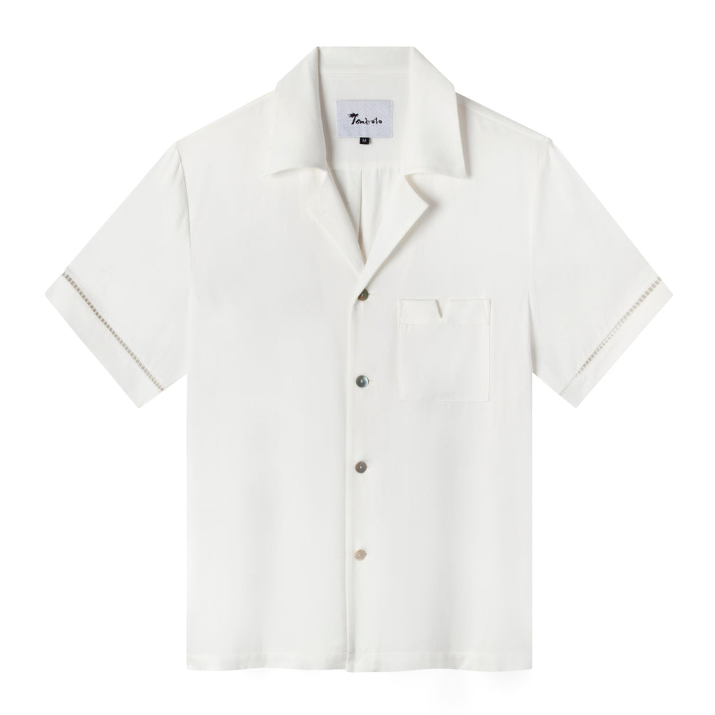 Front view of the White Cabrisa shirt featuring window pane embroidery on sleeves and four buttons down the front