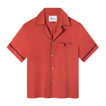 Front view of the valencia red Cabrisa shirt featuring black window pane embroidery on sleeves and black piping along the pocket and collar with four buttons down the front