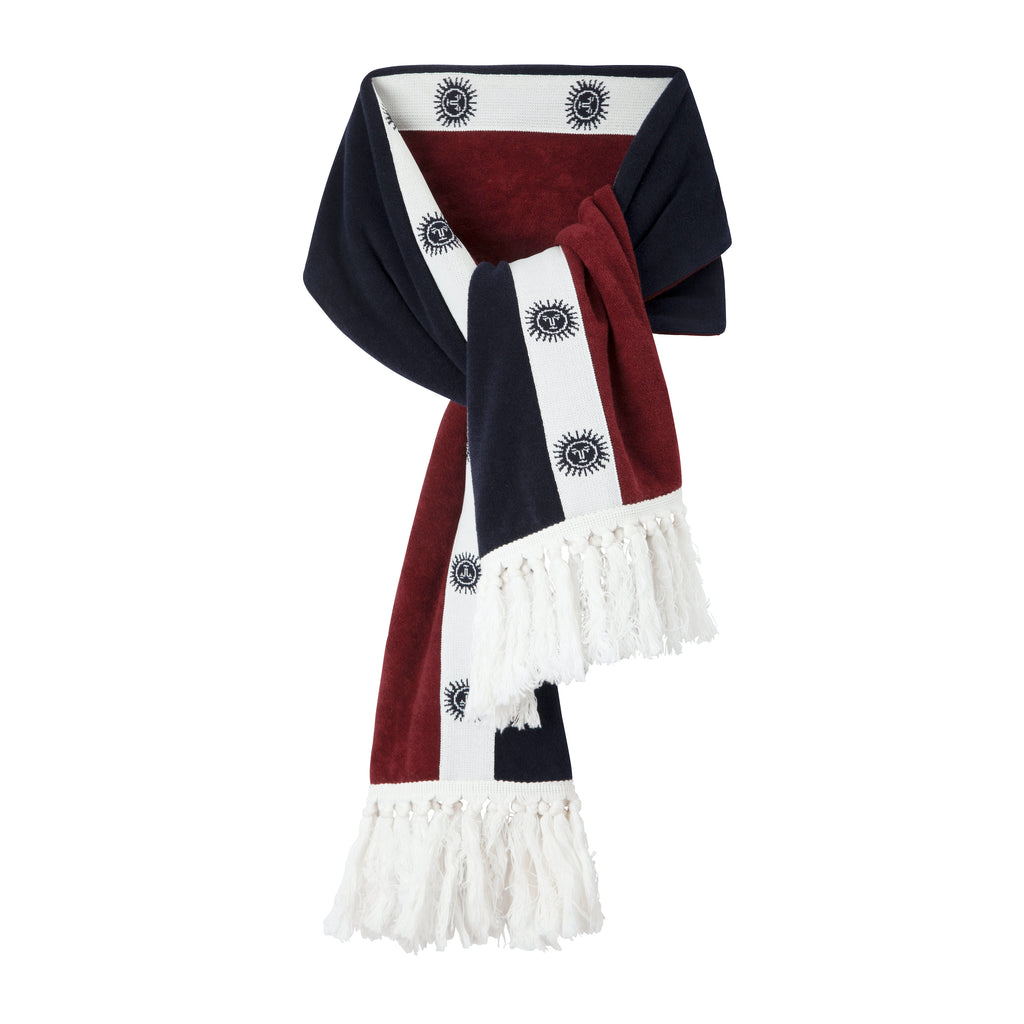 product photo of après ski scarf in maroon, navy, and white with sun motif