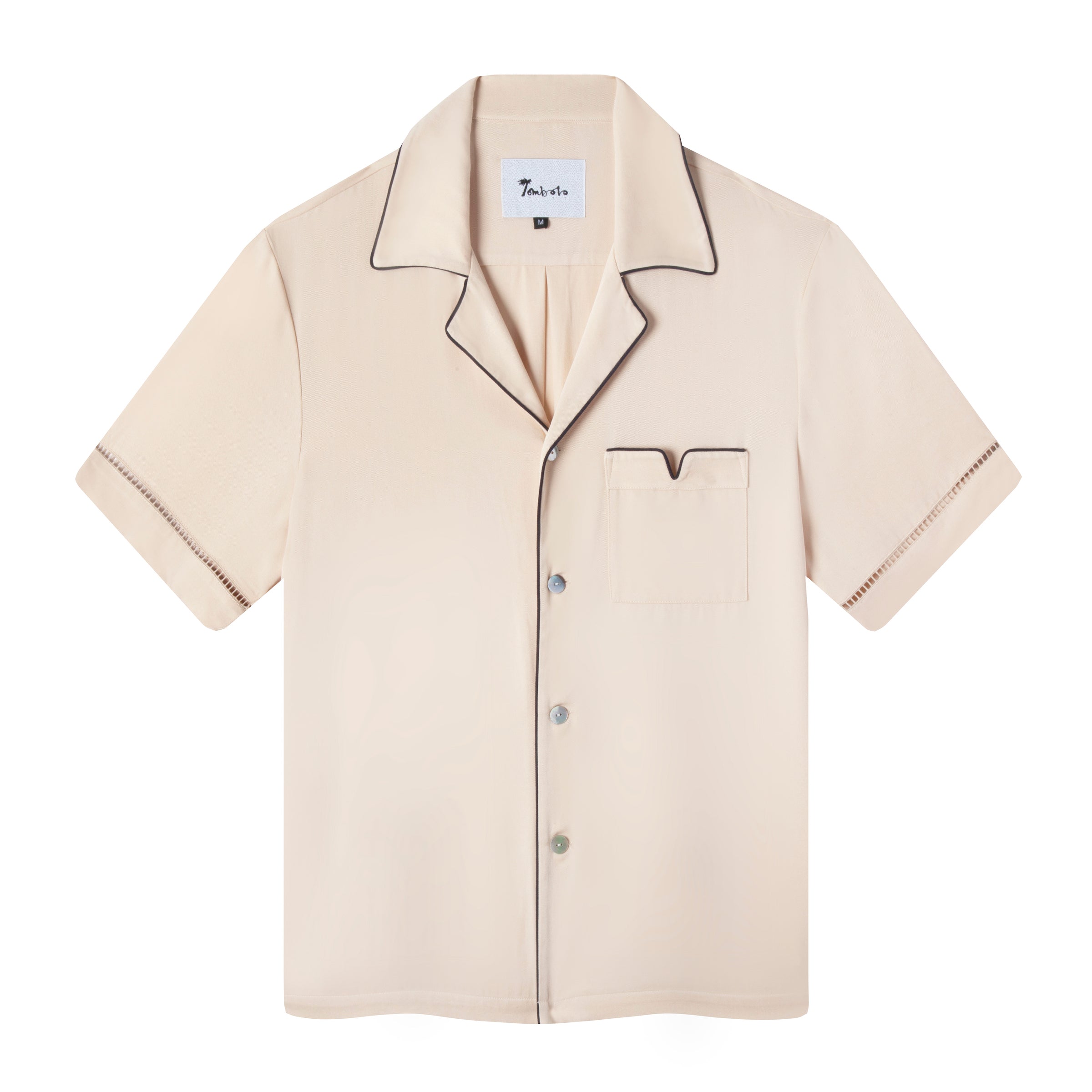 Front view of the Parchment Cabrisa shirt featuring window pane embroidery on sleeves and navy piping along the pocket and collar with grey white buttons down the front