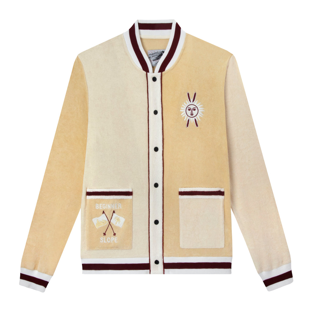 Front lay flat product photo of ski cabana jacket in light yellow white and maroon