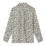 Back view of sunny disposition long sleeve showing box panel draping for ease of movement