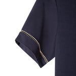 Close up of the beige window pane embroidery on the left sleeve cuff