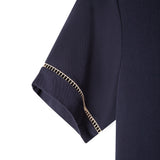 Close up of the beige window pane embroidery on the left sleeve cuff