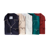 All of the tombolo cabrisa shirt colorways folded up stacked on each other