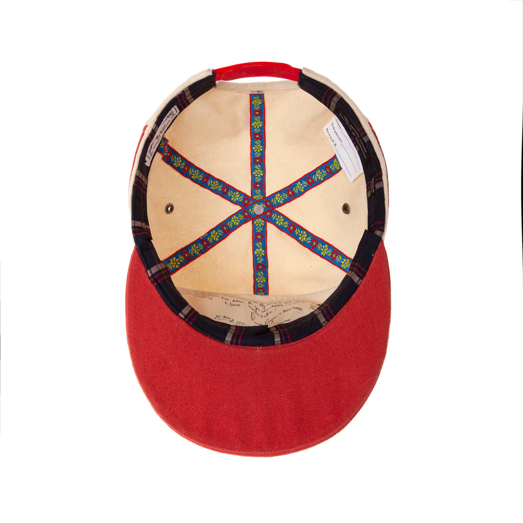 Inside of hat showing inner details including the floral ribbon connecting the seven panels