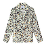 Product photo of shirt depicting the recurring 60s style daisy theme with blue piping on the pockets and collar